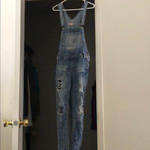 Destroyed jean overalls